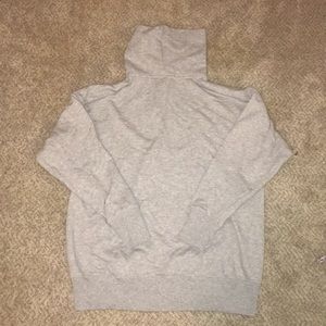 Woman’s grey turtleneck